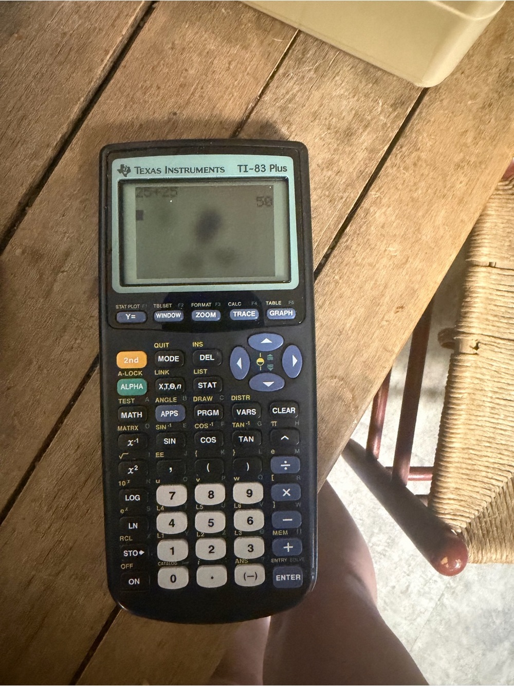 Texas Instruments TI-83 Plus Graphing Calculator in Black with Blue Accents